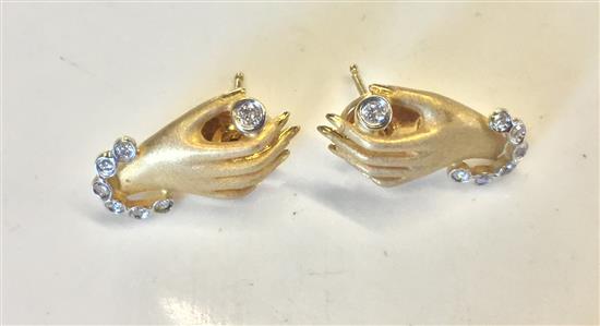 Pair gold hand form diamond earrings